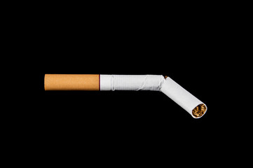 broken cigarette on isolated black background