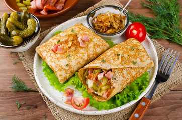 Savory pancakes stuffed with mashed potatoes, pickles and bacon