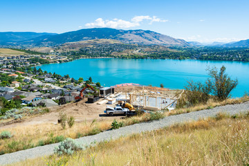 New residential house under construction on Kalamalka lake shore. Beautiful view on Kalamaka lake and mountains