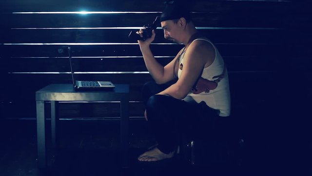 Man the hacker works behind the computer