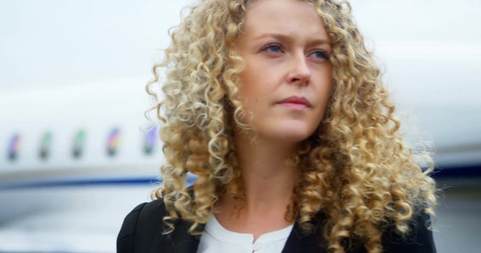Businesswoman standing on a runaway 4k
