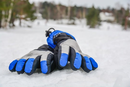 Fashion skiing winter gloves on snow winter mountain cloudy day