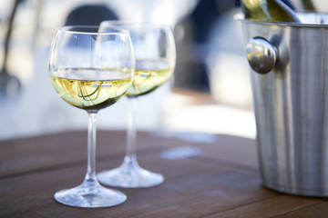 Pair of wineglasses against the yacht