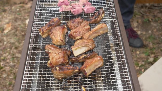 Cooking Barbecue Ribs in the Back Yard