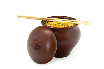 Noodles with chicken and greens in a clay pot, isolated on a white background.