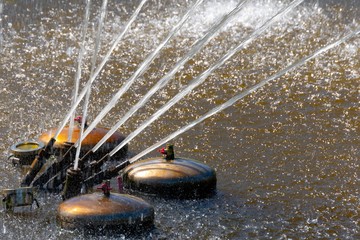 Working fountain nozzles, .streams of water hitting up