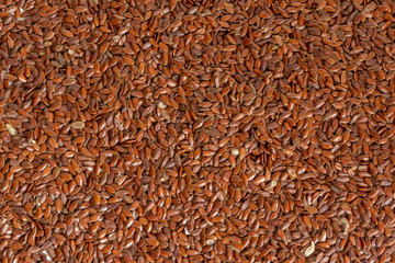 Many raw flax seeds, wholesome ingredient used in cooking.