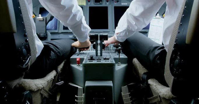 Two male pilots ready to take off private jet 4k