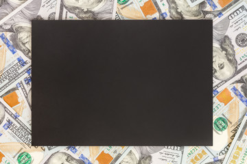 Fototapeta na wymiar Money background with black mockup. Copyspace dark place for text. US currency one hundred dollar banknotes background. Financial, business and investments concept