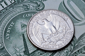 US coin quarter dollar on one dollar bill.