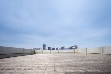 Fototapeta na wymiar empty ground with modern city skyline