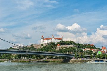 Fototapeta na wymiar Bratislava, Slovakia - May 24, 2018: View of Bratislava castle which occupies a prominent location in the city overlooking the Danube river.