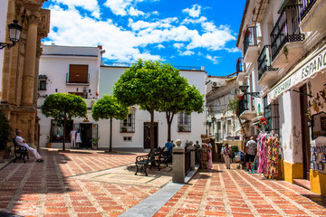 Street. A sunny day in the street of Marbella. Malaga province, Andalusia, Spain. Picture taken – 12 june 2018. - obrazy, fototapety, plakaty