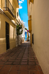Obraz premium Street. A sunny day in the street of Marbella. Malaga province, Andalusia, Spain. Picture taken – 12 june 2018.
