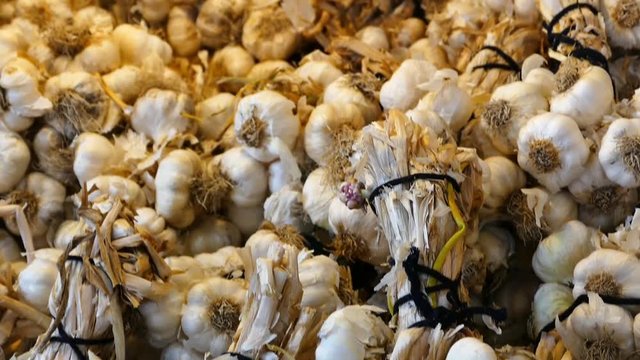 HD video in a grocery store a large amount of garlic,
