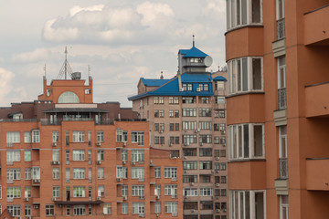 Fototapeta premium high brick buildings with a blue roof