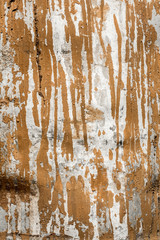 the texture of the damaged aluminum metal surface, gray metal with stripes of brown paint, abstract background