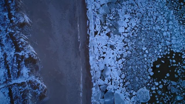 Aerial view of the frozen rocky sea on the coast of Muraste, Estonia.