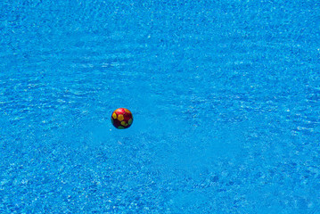 Fototapeta na wymiar Soccer ball floating in a pool