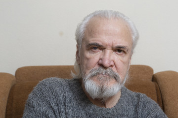 Lonely old man with sore eyes