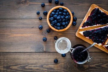 Bluberry toast for breakfast on dark wooden background top view space for text