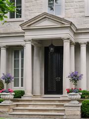Fototapeta na wymiar Front door of house with columns