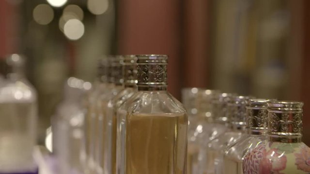 different essential oils in many glass flasks