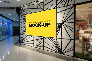 Mock up yellow screen billboard on modern design wall