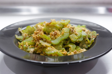 Stir Fried Bitter Gourd with Egg Isolated on white