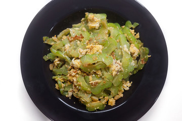 Stir Fried Bitter Gourd with Egg Isolated on white