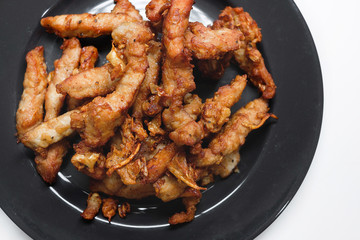 Fried Pork with Garlic Pepper in the black plate