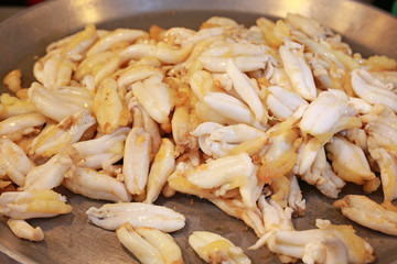 Fried squid eggs in pan, Street food market in thailand.