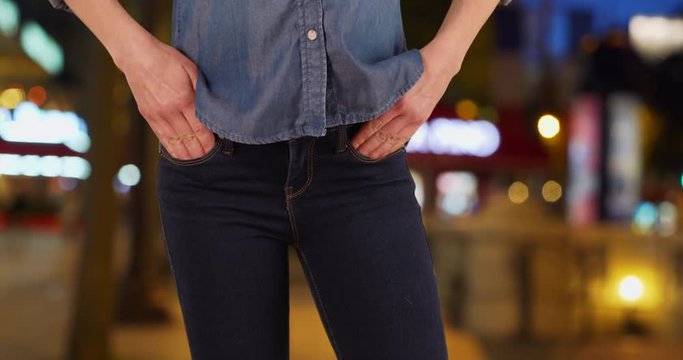 Close up of Caucasian woman in blue jeans, Slender female posing in denim jeans at night, 4k