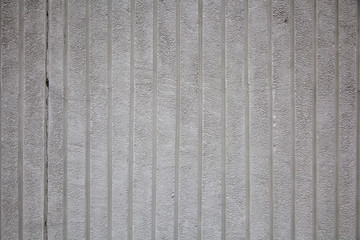 A close-up gray wall