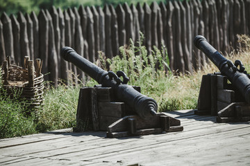 Old cast iron cannon on wooden carriage