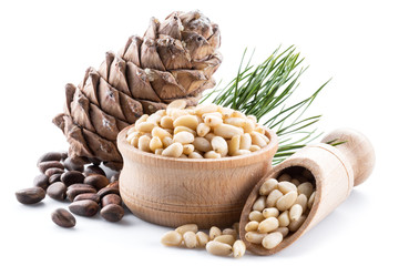Pine nut cone and pine nuts on the white background. Organic food.