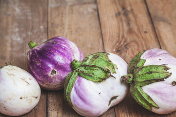 Four ripe eggplant varieties of bumbo lie on boards
