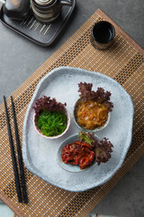 Japanese seasoned baby octopus, seaweed and jellyfish on shaved ice