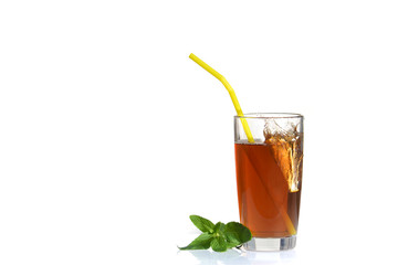 Splashes from a glass of cold tea with lemon.