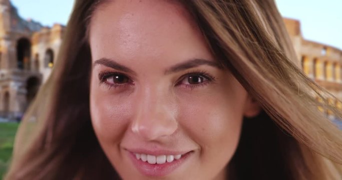 Close up portrait of beautiful Caucasian woman in Rome smiling, Attractive young female in her 20s smiling at camera, 4k