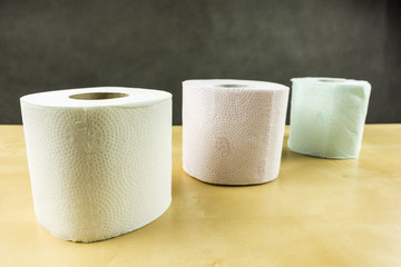 White, red and green roll of toilet paper.