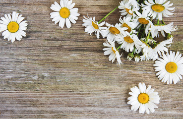 Chamomile flowers on a wooden table