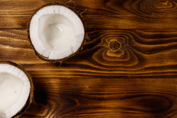 Fresh ripe coconut on rustic wooden table