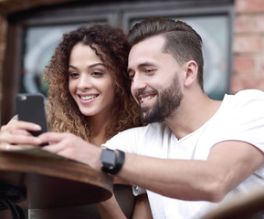 Beautiful couple having coffee on a date,having fun together.