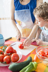 Child helping to cook.