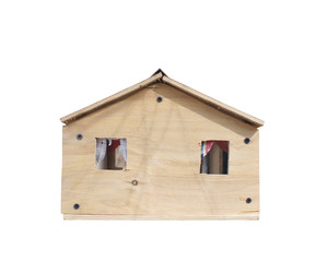Obraz na płótnie Canvas Wooden house isolated on white background. handmade toy house. The concept of housing and poverty. 