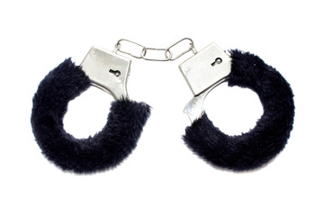 Handcuffs with fur on white background. Accessory for love games. black.   