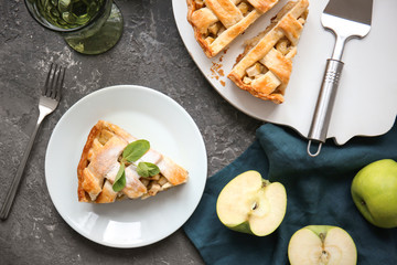 Composition with tasty apple pie on table