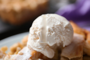 Ice-cream on piece of tasty apple pie, closeup