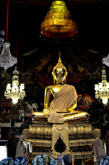 Statue of Budhha in gold at Thai temple Bangkok 